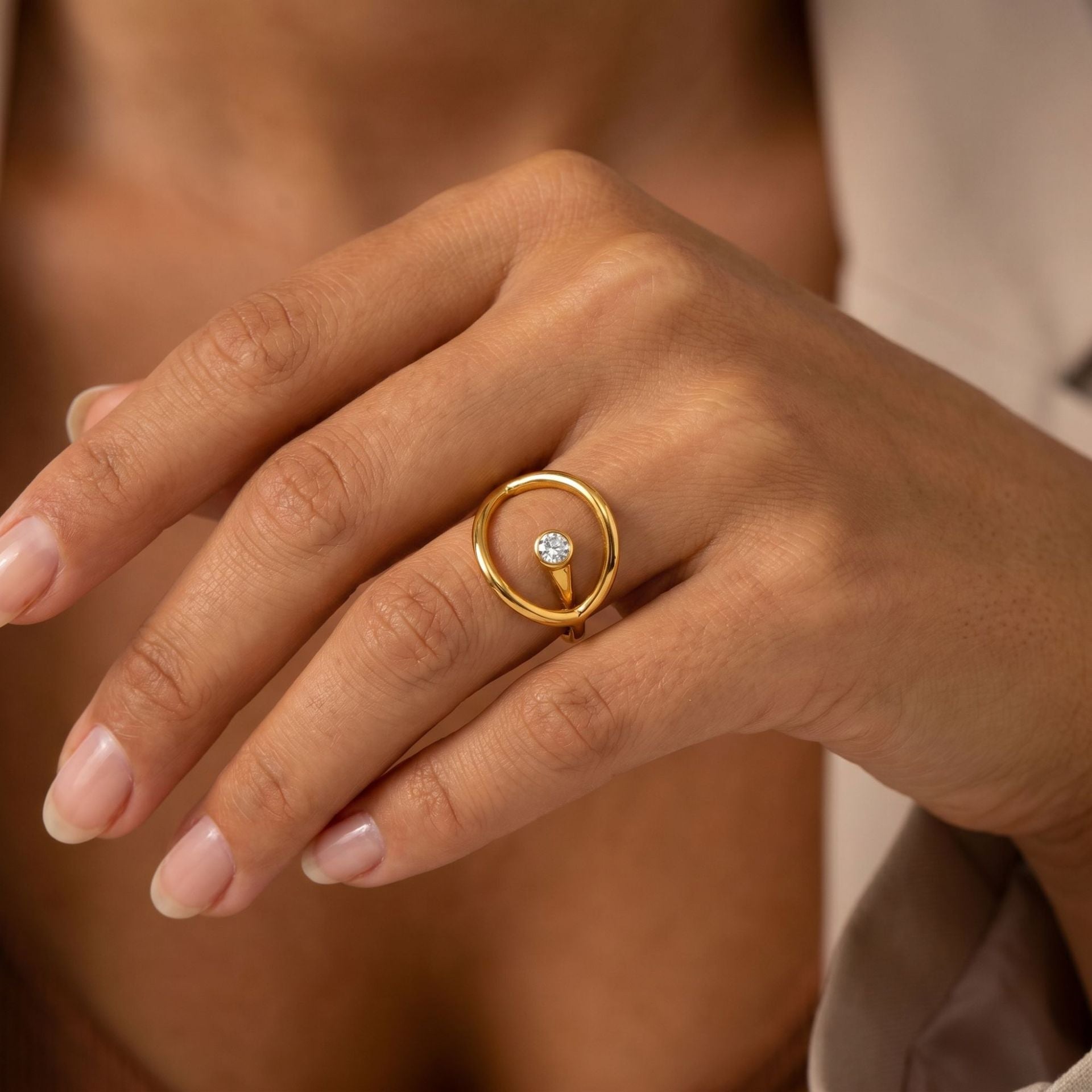 Modern minimalist 18K gold plated circle ring on hand